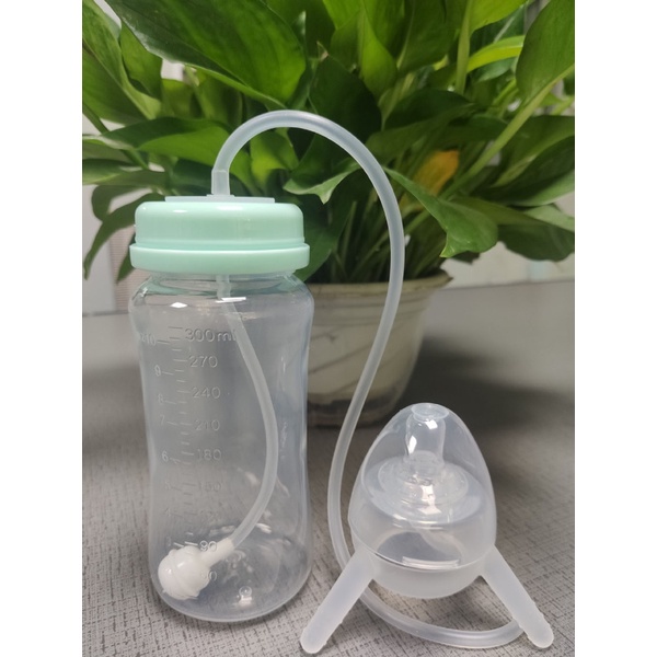 Bình uống sữa em bé tự động có ống hút dài rảnh tay chống colic 300 ml