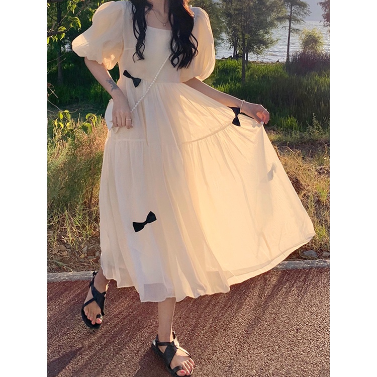 Váy voan tay phồng dập viền xòe dài bồng bềnh công chúa cổ tích đính nơ đen điệu đà