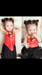 Yếm đào thêu hoa cho bé