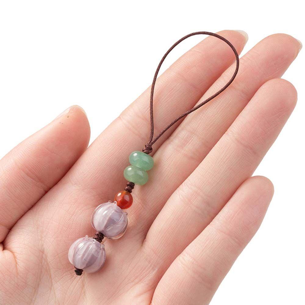 Dây Treo Điện Thoại Hình Chuông Hoa Lan May Mắn Chống Thất Lạc
