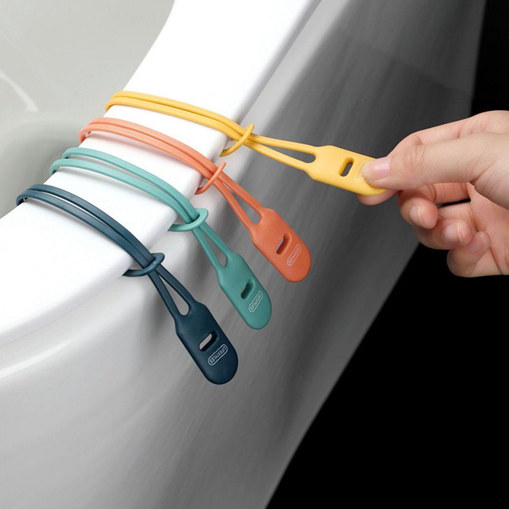 Dụng Cụ Nhấc Nắp Bồn Cầu Bằng Silicone Tự Dính Tiện Dụng
