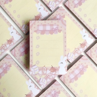 Memopad hộp sữa và thỏ trắng