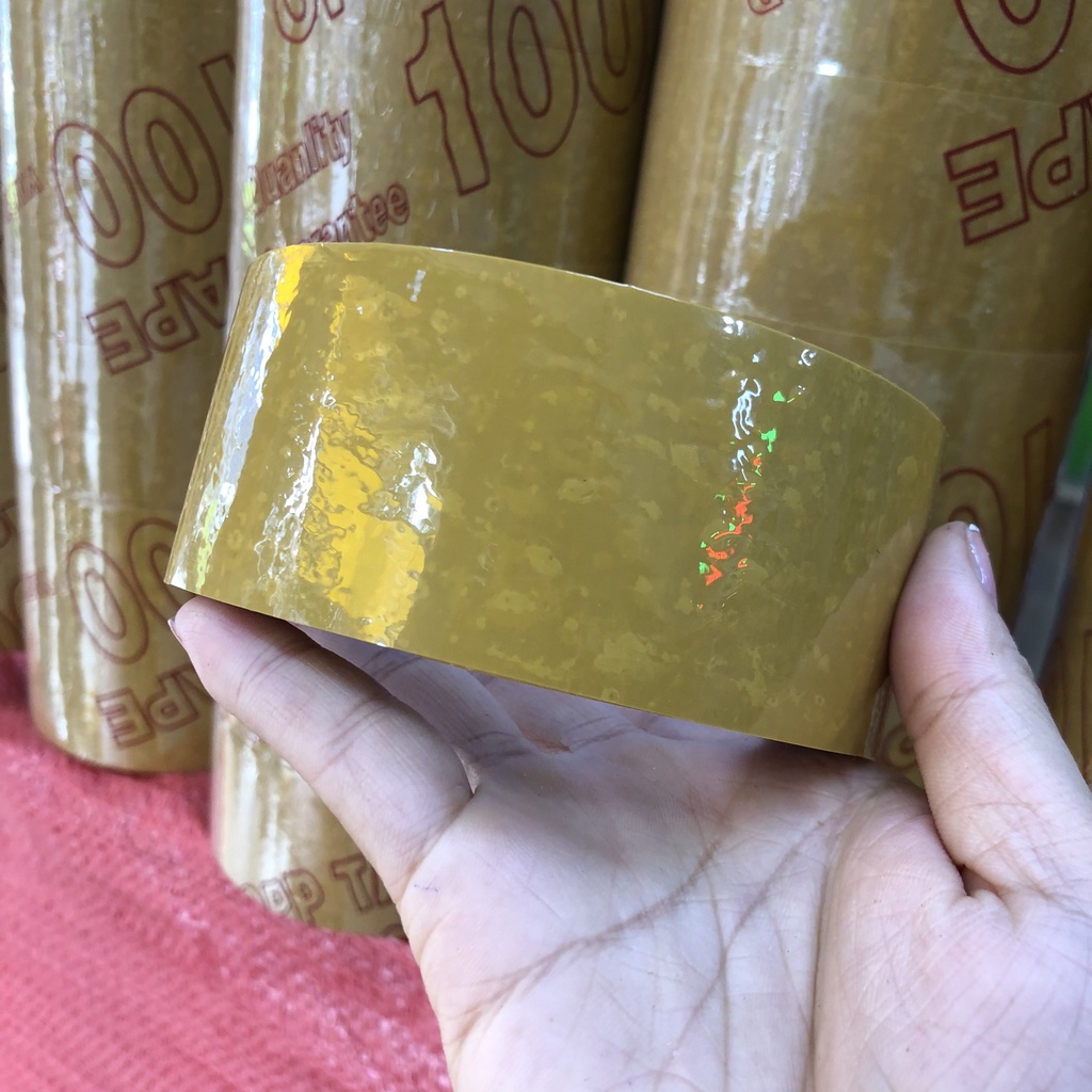 Băng keo vàng đục 4,8cm-200yard lõi 3.5li để đóng hàng 1,2kg 6 cuộn giá sỉ