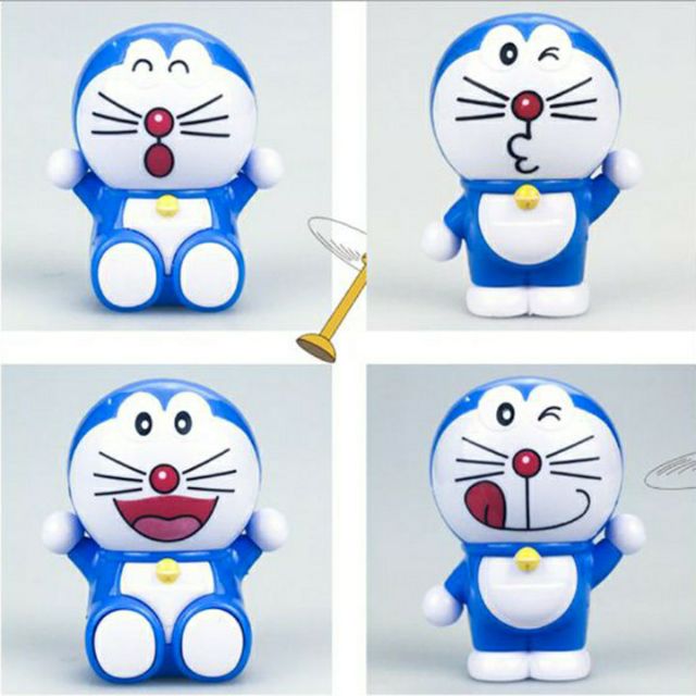 Túi 4 mèo Doraemon trang trí bánh kem trưng bày trong phòng cực xinh