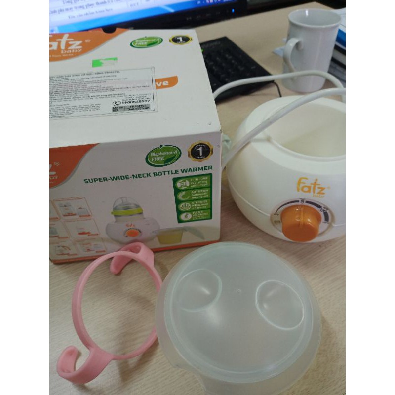 Thanh lý máy hâm sữa fatzbaby tặng tay cầm bình comotomo