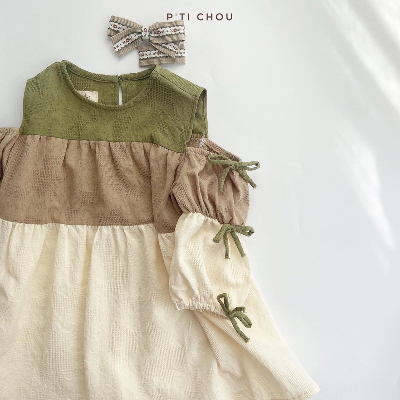 Naeon dress Váy bé gái thiết kế P'ti chou hở vải mix màu và nơ cho bé 12kg đến 23kg
