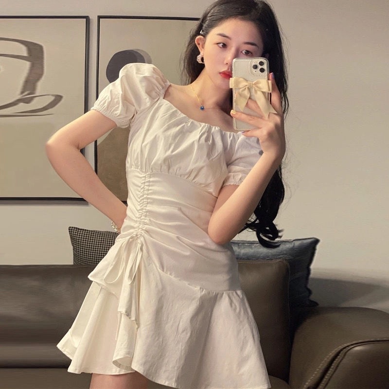 Đầmtrắng xếp ly phối dây rút thiết kế lệch tà cá tính thời trang
