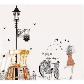 Decal dán tường Cột đèn đêm + cô gái xe đạp