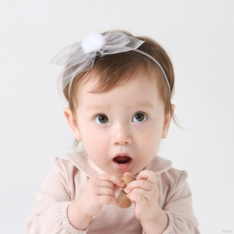 Băng đeo đầu có chi tiết quả bóng lông dễ thương cho bé