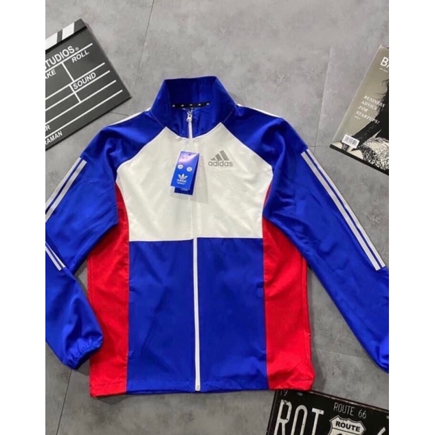 Áo Khoác Gió Nhẹ Nam Nữ 2 Lớp Có Mũ Chống Nắng Màu Xanh Trắng ADIDAS Thể Thao - Áo Khoác Dù Nam Nữ Form Xuông Có Dây Rút