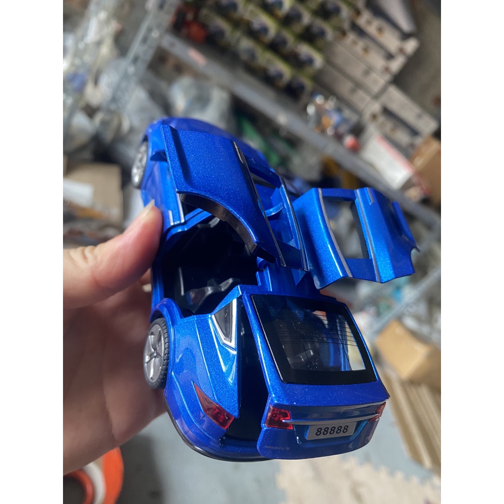 Đồ chơi mô hình xe TESLA KAVY chất liệu hợp kim có nhạc đèn mở được tất cả cánh cửa tỷ lệ 1:32