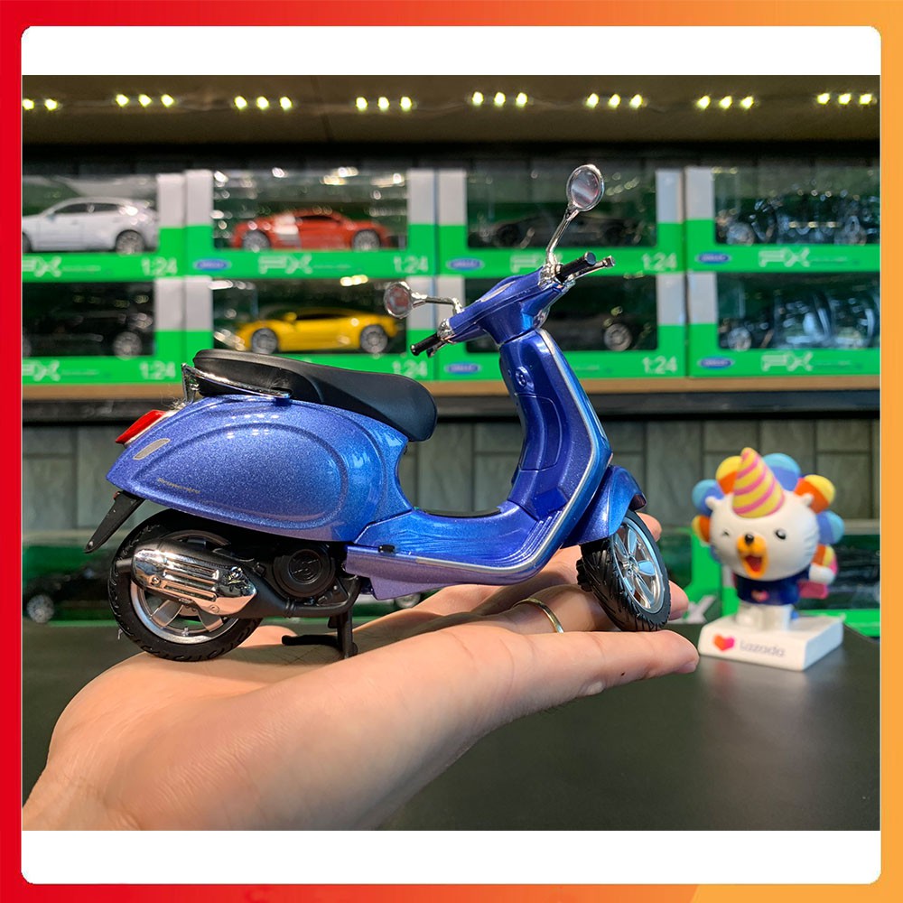 Mô hình xe Vespa Primavera tỉ lệ 1:12 Maisto màu xanh