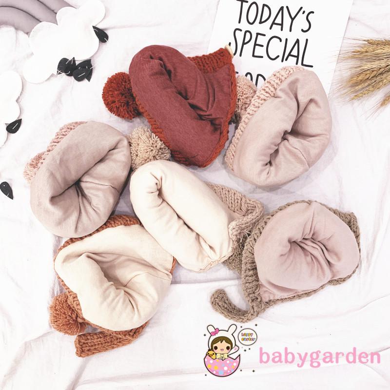 Mũ len trùm tai màu trơn có quả bông dễ thương cho trẻ em