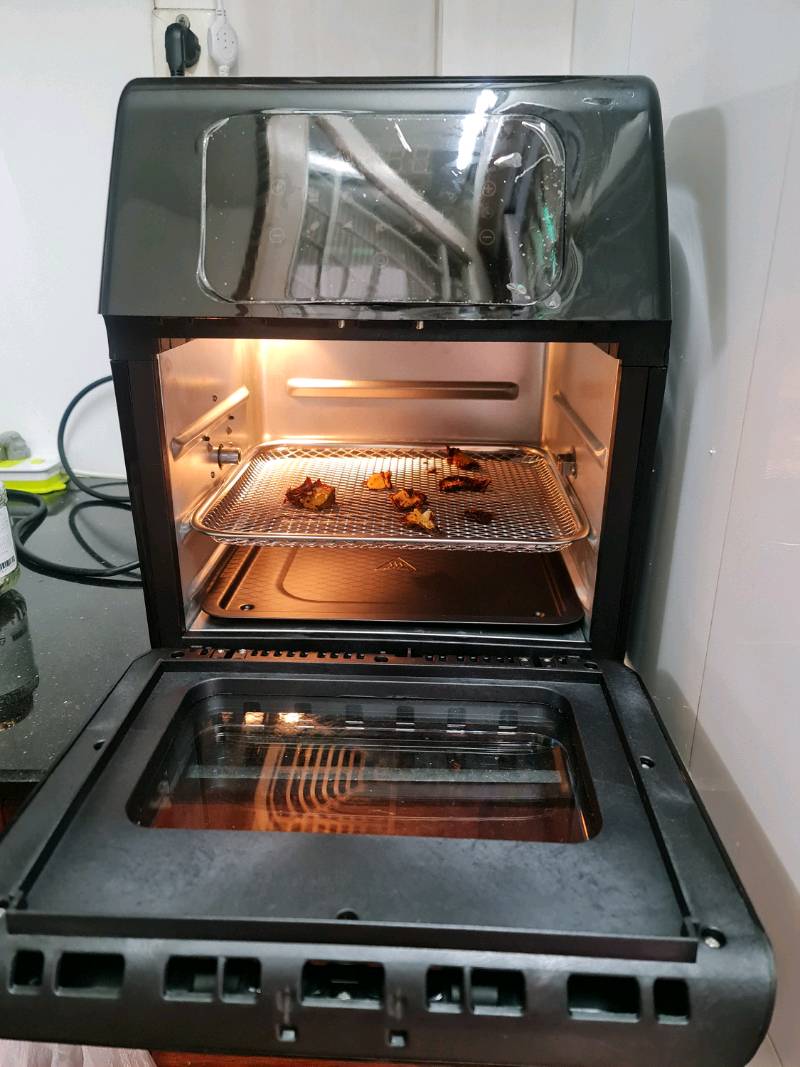 An aerial view of a field. A road runs through the upper right corner.