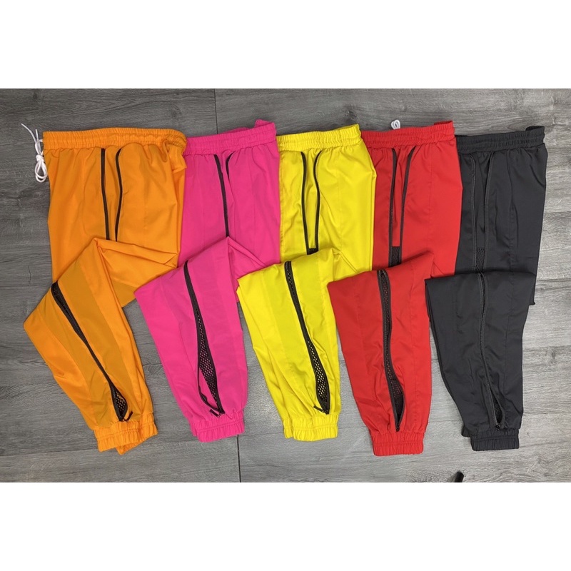 Quần jogger vải dù co giãn phối lưới 2 khoá kéo tập gym, yoga nữ