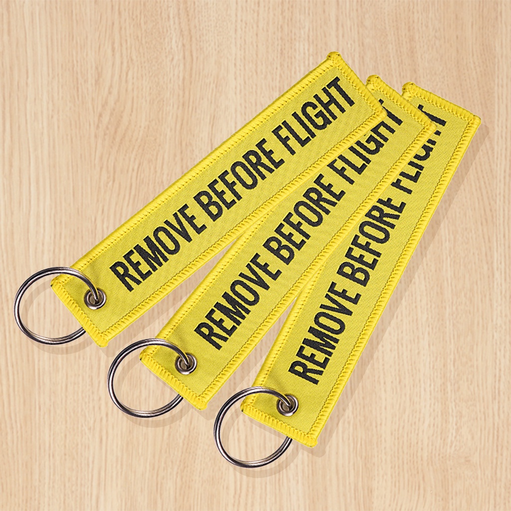 Móc khóa họa tiết chữ Remove Before Flight thời trang
