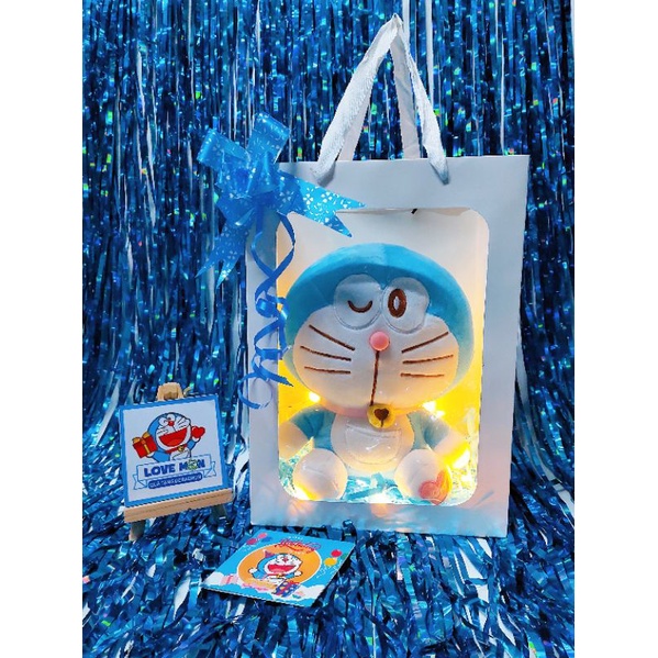 ] GẤU BÔNG DORAEMON KÈM TÚI GIẤY KÍNH DỄ THƯƠNG
