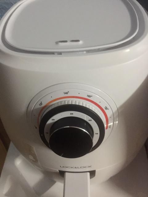 An aerial view of a field. A road runs through the upper right corner.