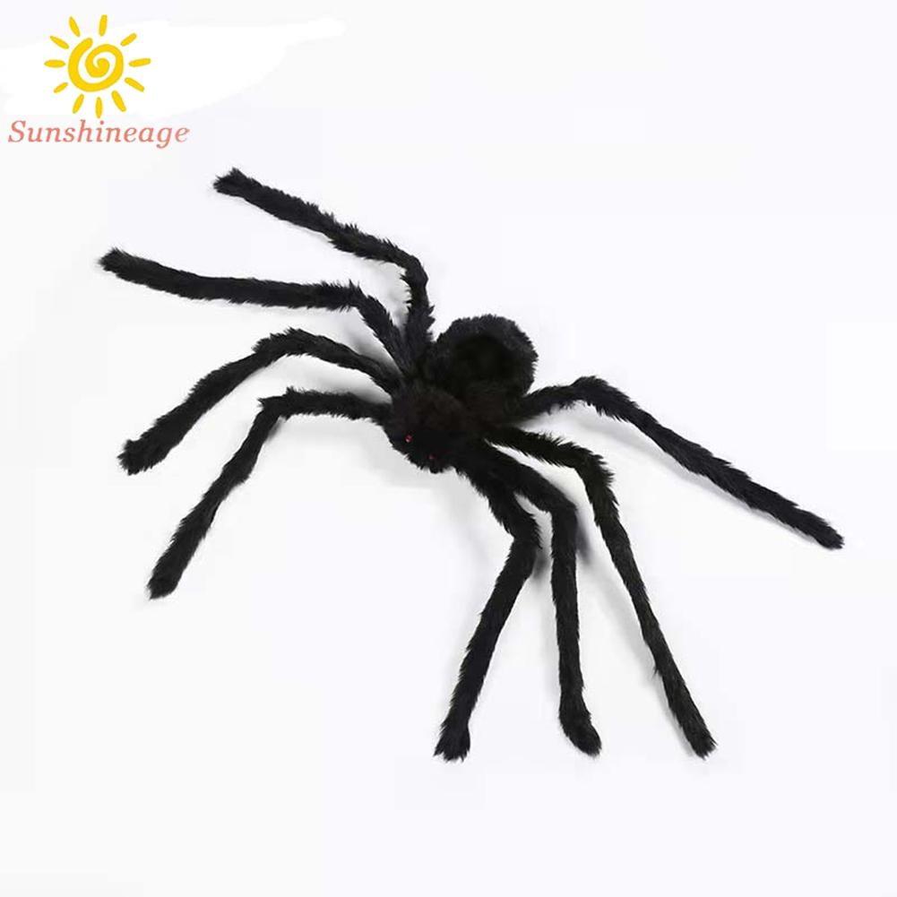 Halloween giant spiders hang in haunted homes, decorated with black fake spiders, cunning toys and Halloween gifts