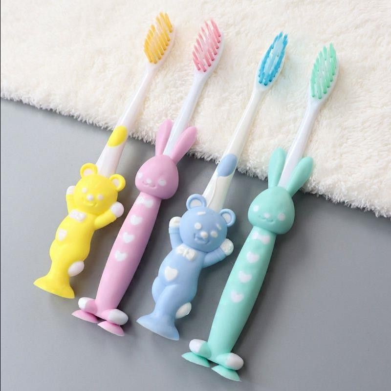 Set 4 bàn chải hình thú cho bé - đế mềm đứng được tiện lợi.