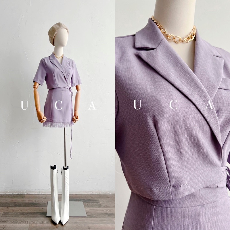 Váy set tím: áo cổ vest tay cộc, chân váy a ngắn cùng màu