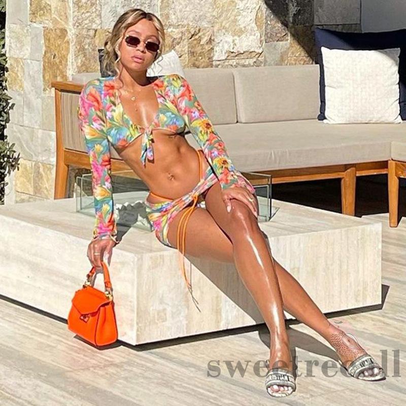 Bộ đồ 2 món áo croptop tay dài cổ chữ V buộc dây in họa tiết hoa + chân váy dây rút thời trang đi biển cho nữ | BigBuy360 - bigbuy360.vn