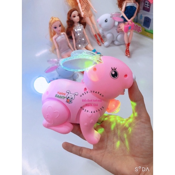 Đồ chơi con thỏ dùng pin tự nhảy .có đèn và nhạc vui nhộn  có dây cho bé cầm dắt đi