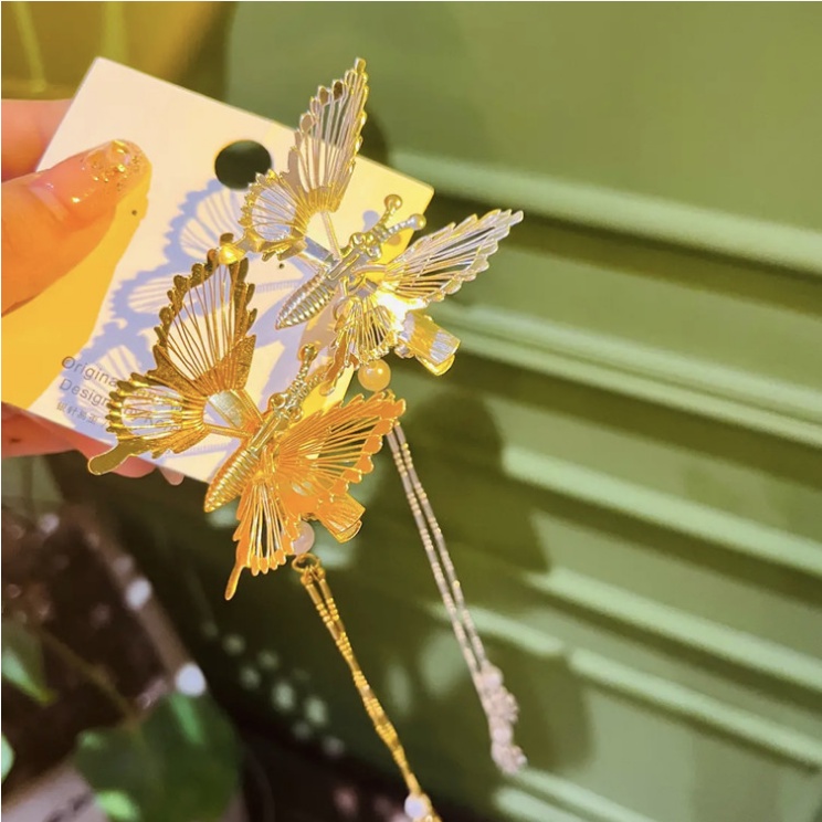 Set 2 kẹp tóc HAIMEIKANG kim loại hình bướm phối tua rua thời trang Hàn Quốc cho nữ