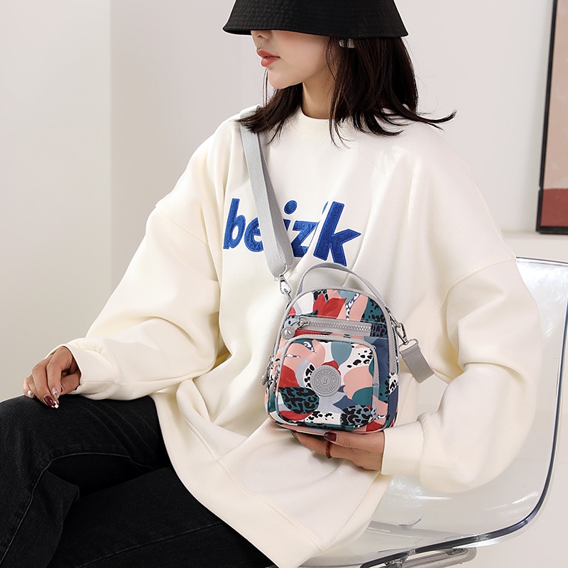 Túi Đeo Chéo Sợi Nylon Họa Tiết Hoa Phong Cách Mới Cho Nữ