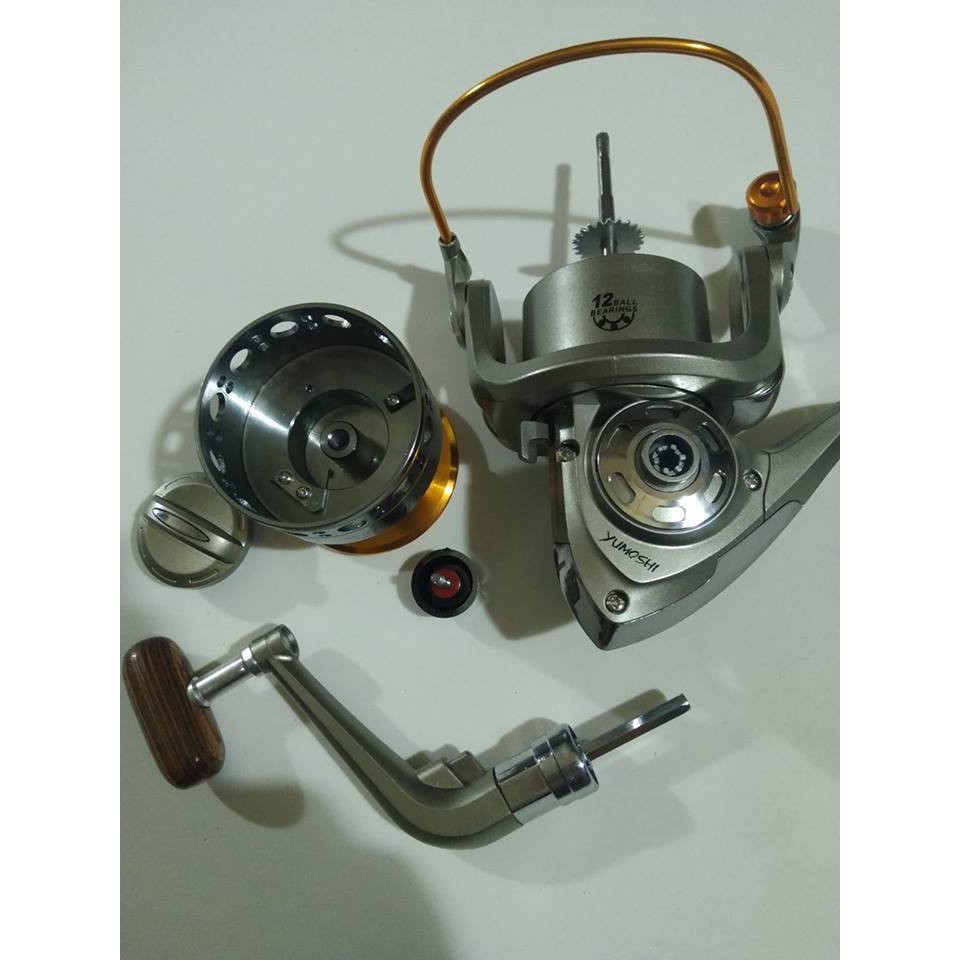 Bộ Cần Câu 2 khúc Shimano Đặc, Máy Yumoshi LC 6000-7000 và phụ kiện đồ câu 99
