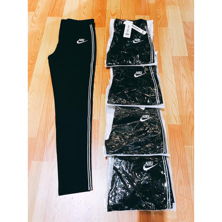Quần legging lưng cao có dây kéo viền sọc