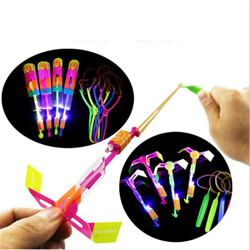 Đồ Chơi Ná Bắn Chong Chóng Xoay Có Đèn Led Bắn Bằng Thun