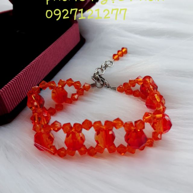 Vòng tay pha lê swarovski màu cam rực rõ của nước Áo. Là 1 loại trang sức được giới trẻ hiện nay săn đón