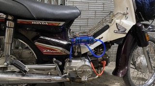 bình thông hơi titan xe máy
