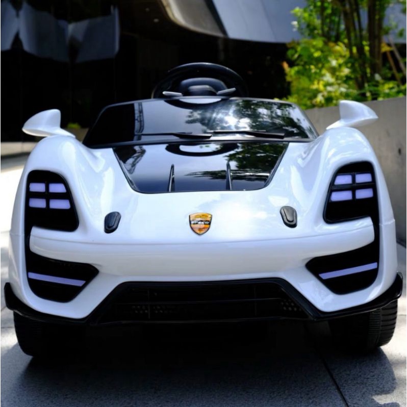 Xe ô tô điện cho trẻ nhạc mp3 điều khiển từ xa bằng điện thoại,,,