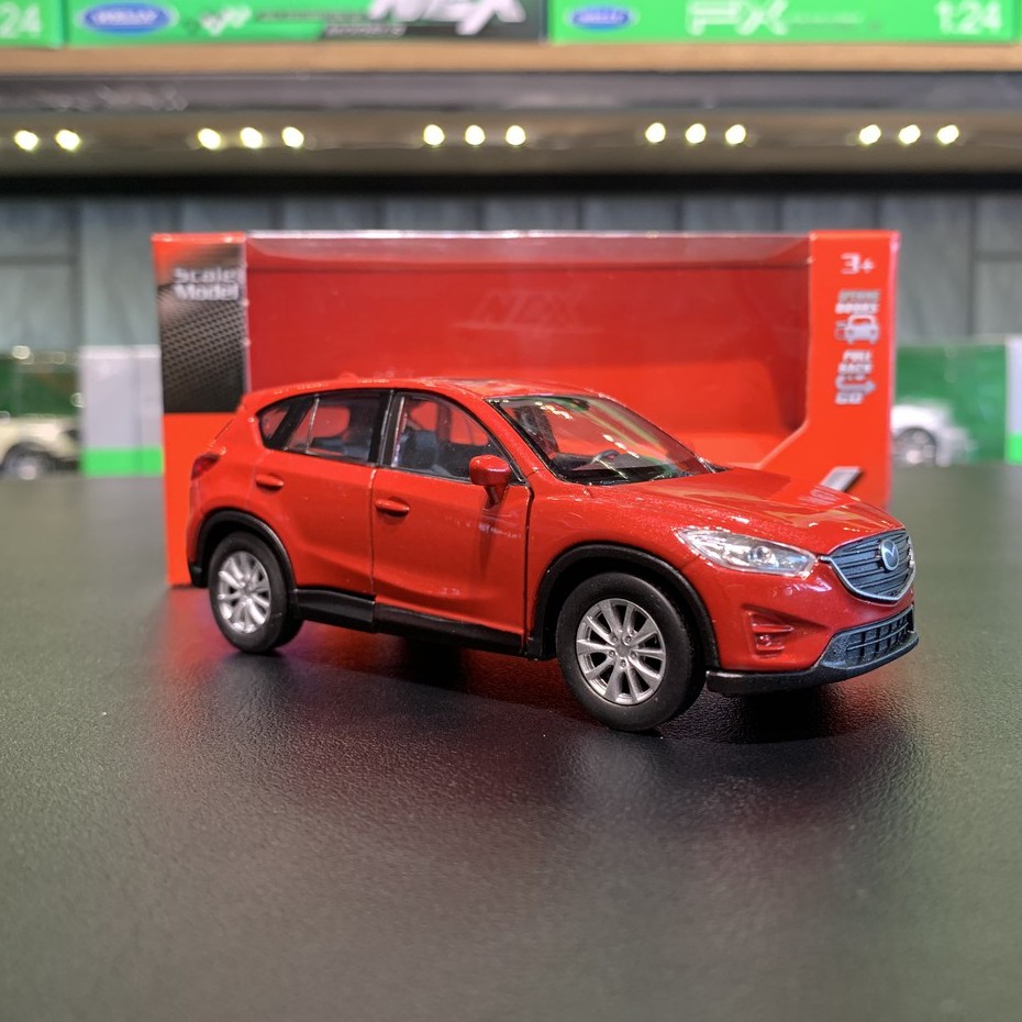Mô hình xe ô tô Mazda Cx5  tỉ lệ 1:36 hãng Welly màu đỏ