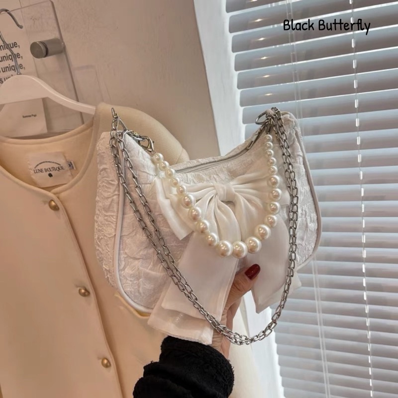 Túi đeo chéo đính nơ vải sần Butterfly