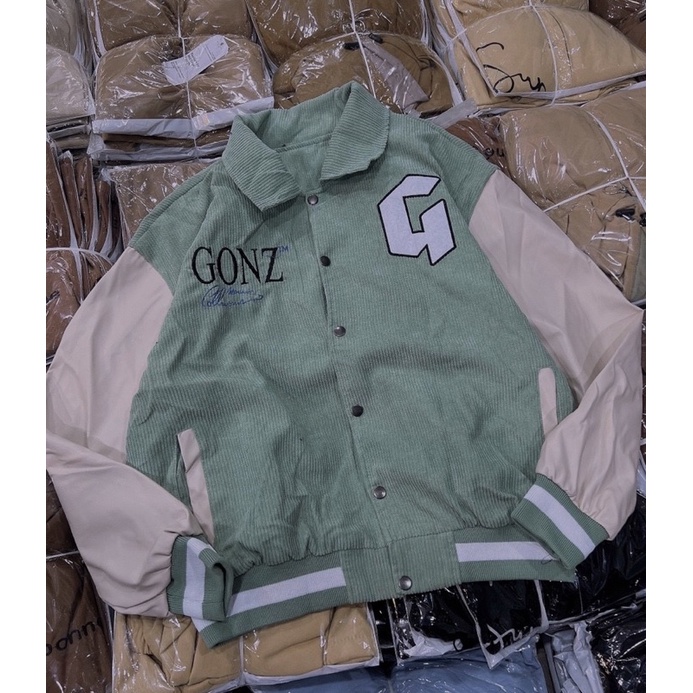 Áo khoác nhung tăm phối tay da lạ mắt in lưng