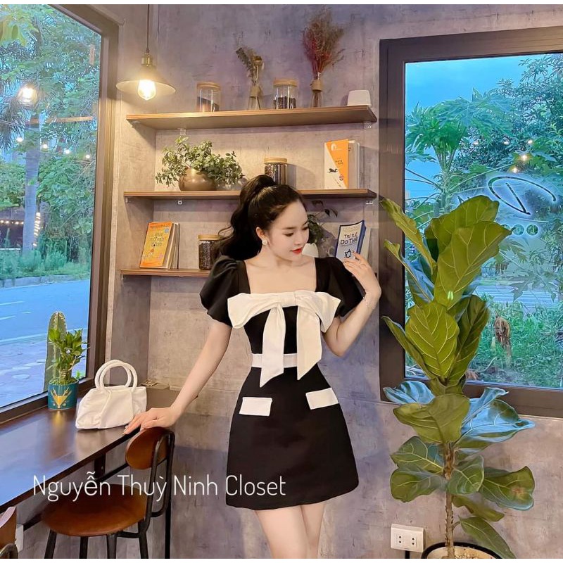 Đầm khoét cổ đính nơ hở lưng tiểu thư