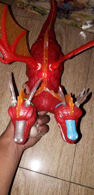 Khủng long chạy PIN 2 đầu có cánh và đẻ trứng có nhạc đèn Led tặng kèm PIN