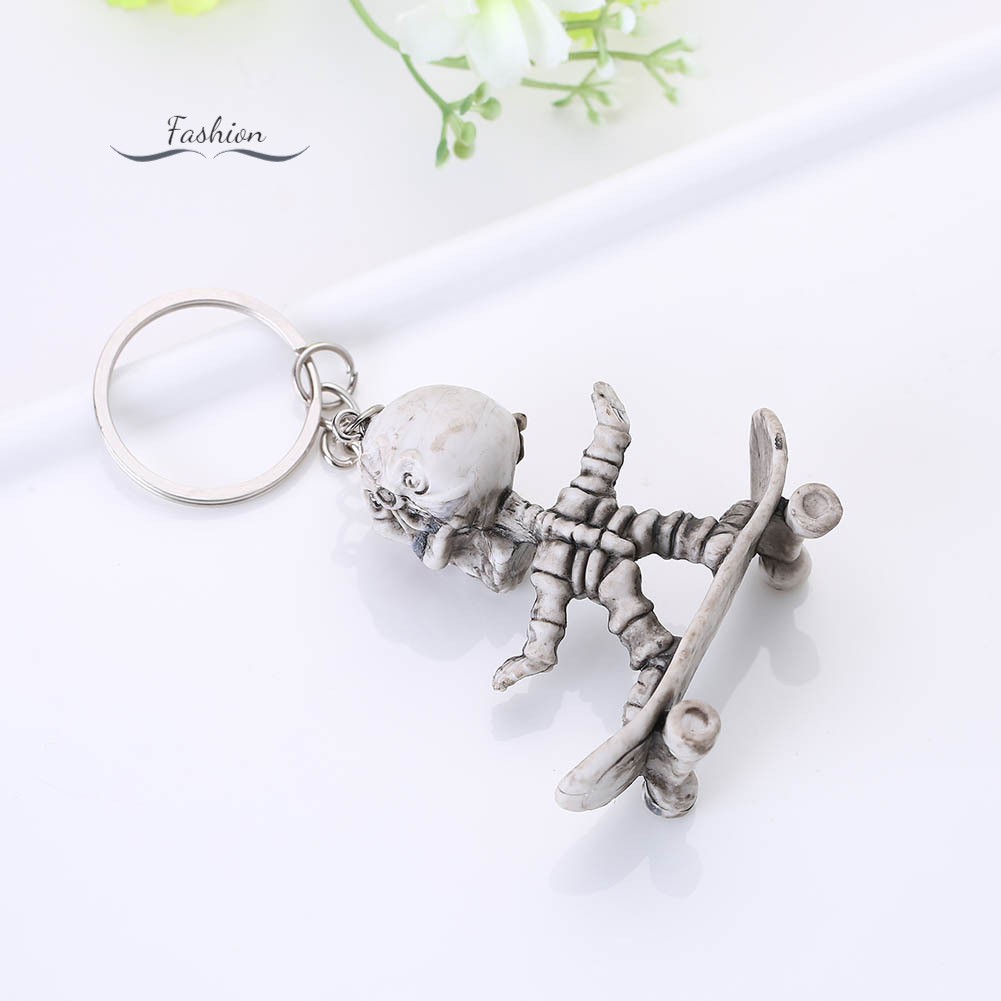 Móc khóa mặt hình bộ xương chơi ván trượt đáng yêu độc đáo treo túi xách chìa khóa xe hơi