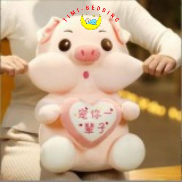 Gấu bông lợn hồng ôm trái tim cute, ngộ nghĩnh đáng yêu – Gấu bông hình con heo - Timibedding
