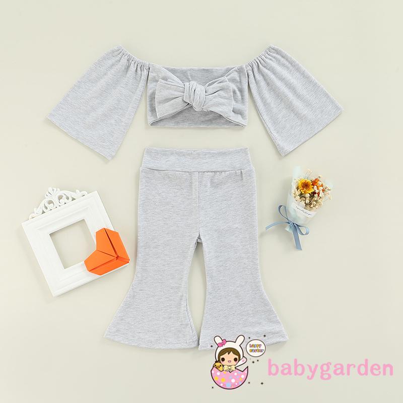 Set đồ 2 món áo croptop trễ vai thắt nơ + quần ống loe màu trơn cho bé gái