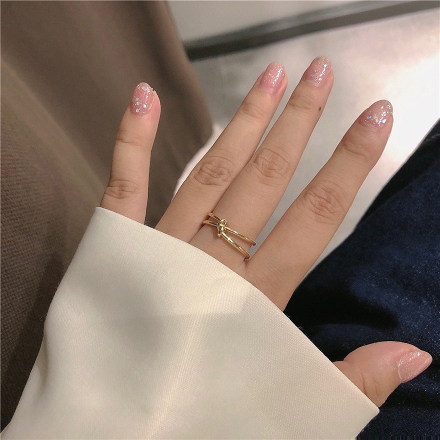 Nhẫn hở bằng thép titan màu vàng đồng thiết kế thắt nút đơn giản sáng tạo thời trang cho nữ
