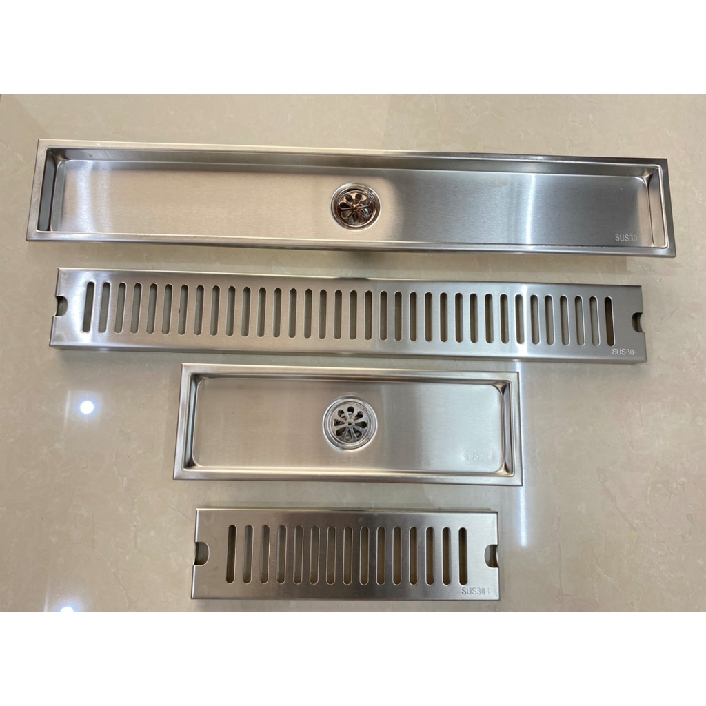 Ga thoát sàn ngăn mùi 60cm và 30 cm lỗ lệch ,lỗ cân, Inox 304, kt: dài 60cmx10cm và 30cm x10 cm,vừaống phi 48 đến phi 90