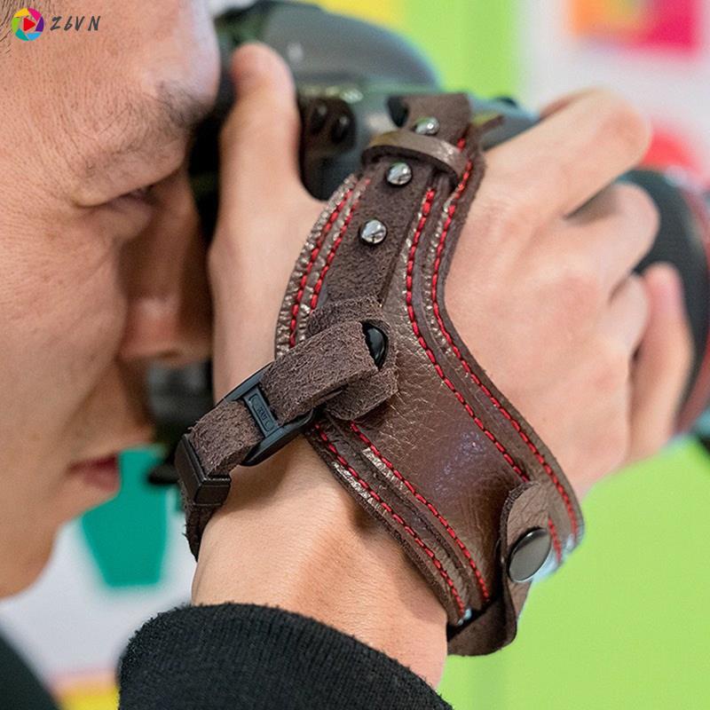 Dây đeo cổ tay bằng da màu đen chống sốc cho máy ảnh Canon/Nikon/Sony/DSLR