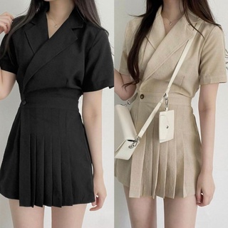 Jumpsuit cổ vest đắp chéo phối nút xếp ly