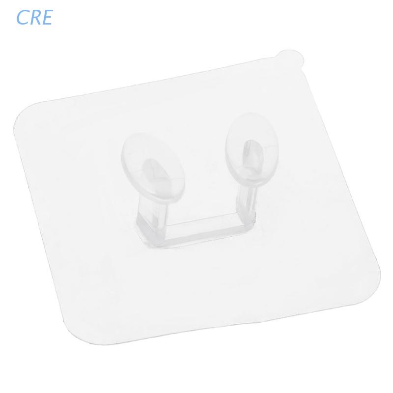 Giá đỡ phích cắm dán tường trong suốt tiện dụng