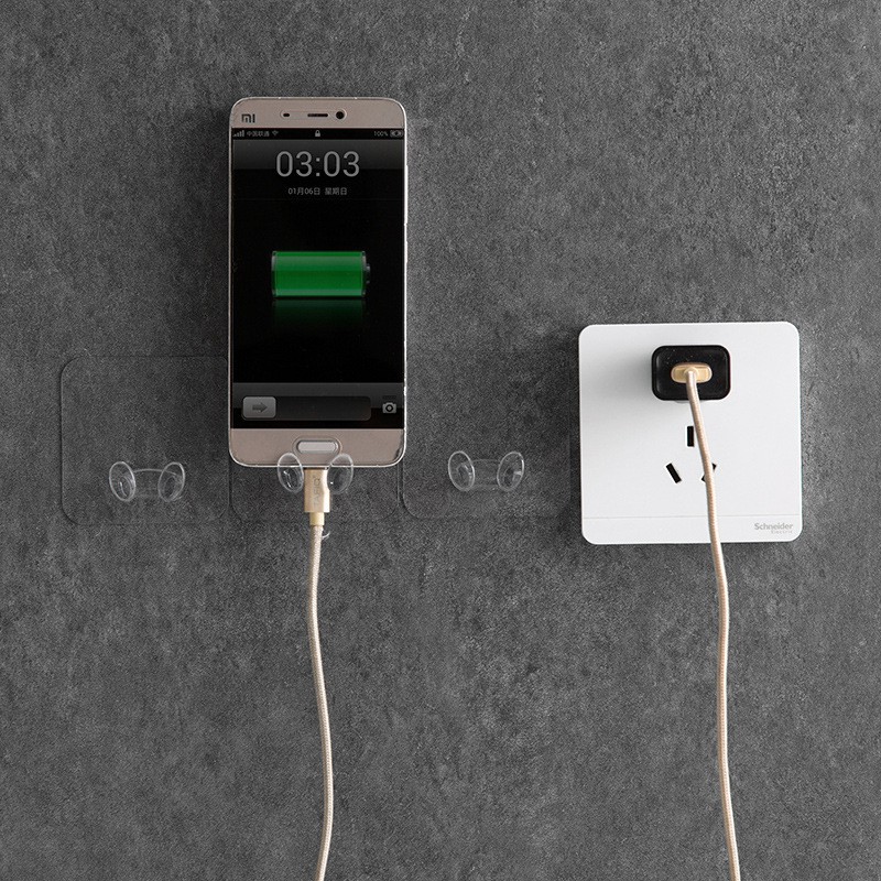 Giá dán tường treo phích cắm điện, remote kiêm giá để điện thoại khi sạc pin trên tường