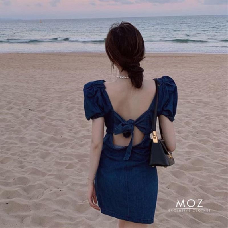 Váy xanh nơ sau hở lưng